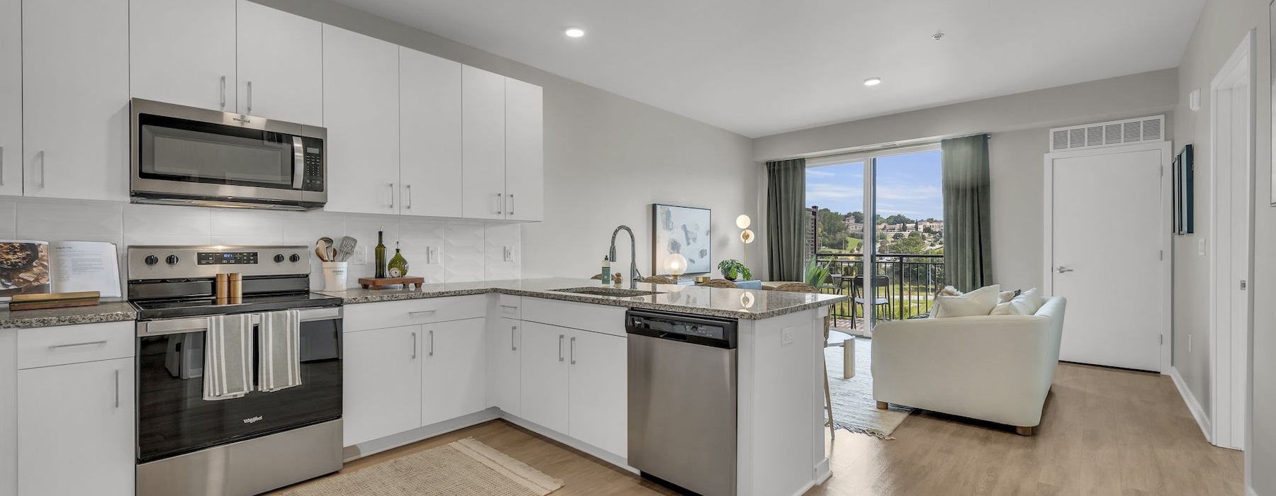 a large kitchen with white cabinets