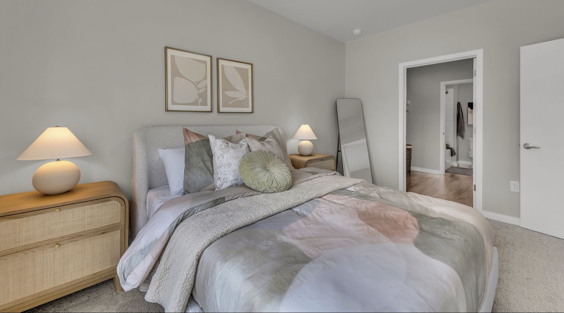 a bedroom with a bed and two nightstands