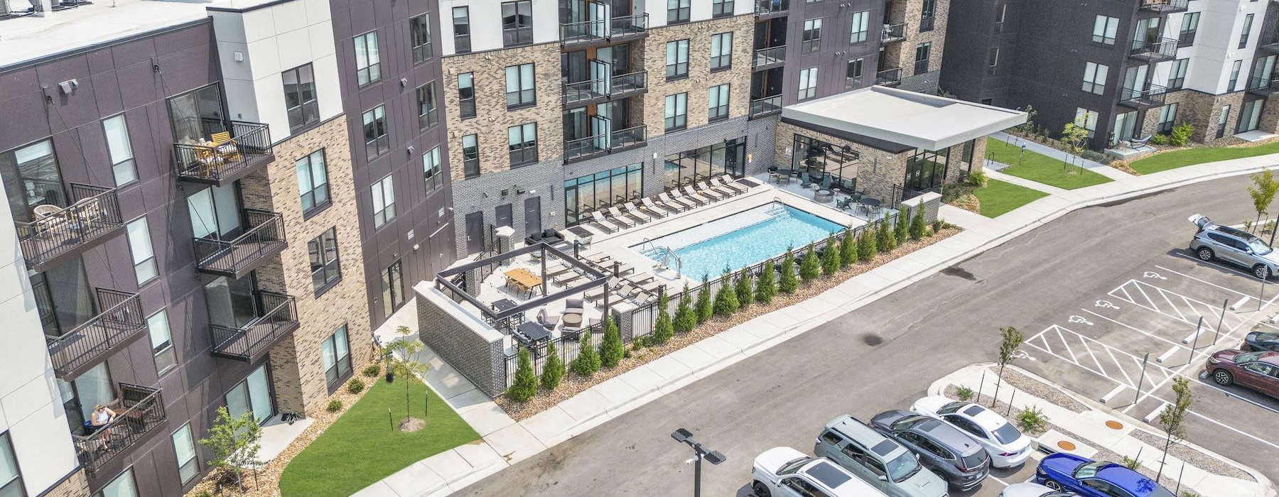 a parking lot with cars and buildings