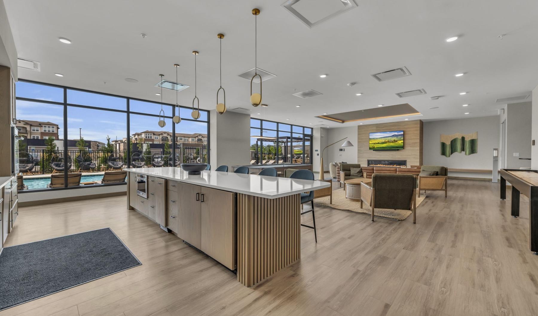 a clubroom with a kitchen area and a lounge area