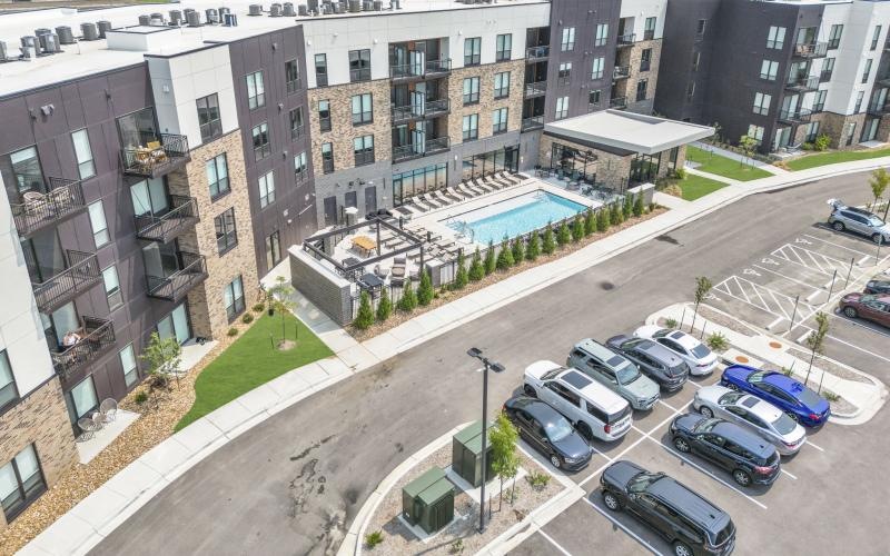 a parking lot with cars and buildings